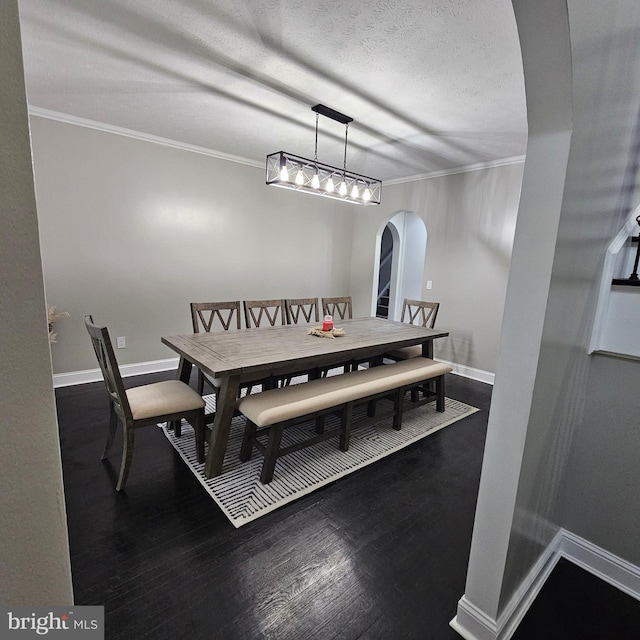 681 Hillcrest Dr, New Creek, WV 26743 - dining space featuring arched walkways, ornamental molding, dark wood finished floors, and a textured ceiling