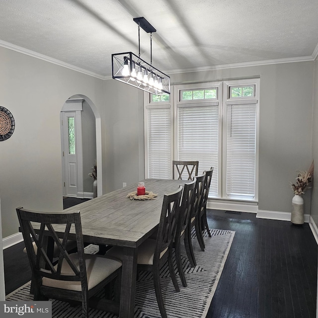 681 Hillcrest Dr, New Creek, WV 26743 - dining area featuring arched walkways, plenty of natural light, dark wood-style flooring, ornamental molding, and a textured ceiling