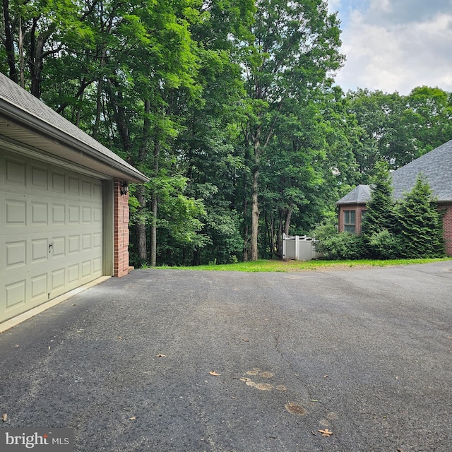 681 Hillcrest Dr, New Creek, WV 26743 - garage featuring asphalt driveway
