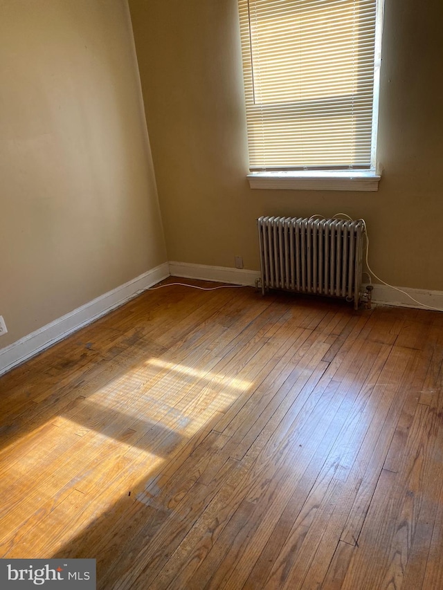 1642 Rosedale St NE, Washington, DC 20002 - unfurnished room with radiator and hardwood / wood-style floors