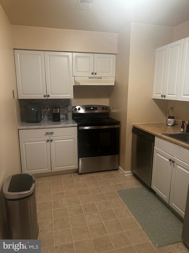 2005 Magnolia Woods Ct Unit F, Edgewood, MD 21040 - kitchen with stainless steel appliances, white cabinetry, under cabinet range hood, and light countertops