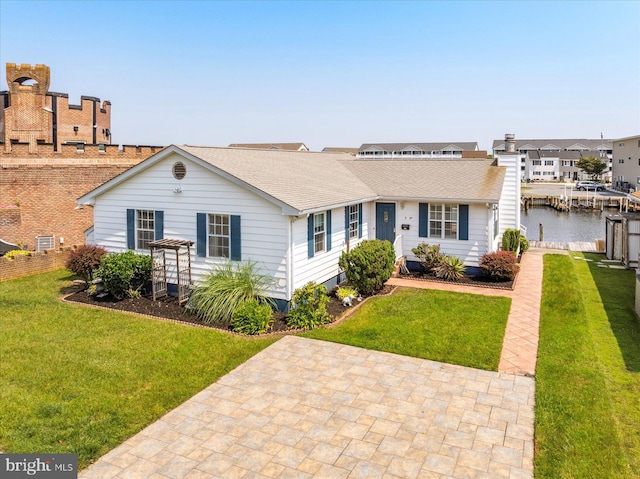 156 Captains Quarters Rd, Ocean City, MD 21842 - view of front of home with a front lawn, roof with shingles, and a water view