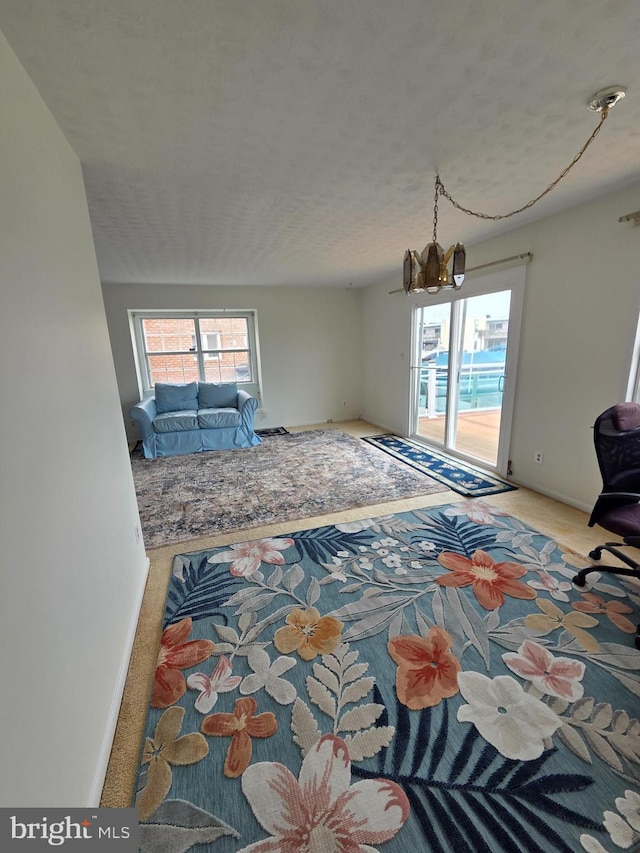 156 Captains Quarters Rd, Ocean City, MD 21842 - living area featuring carpet and a chandelier