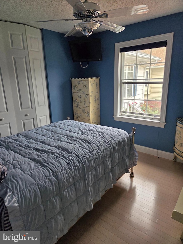 156 Captains Quarters Rd, Ocean City, MD 21842 - bedroom featuring a closet, wood finished floors, and ceiling fan