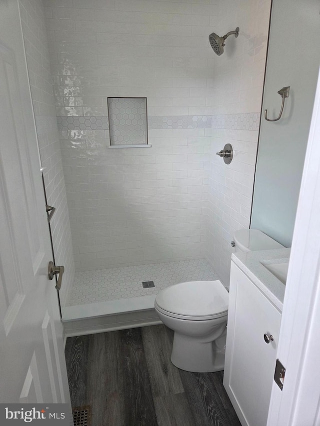 156 Captains Quarters Rd, Ocean City, MD 21842 - bathroom with wood finished floors, a shower stall, and vanity