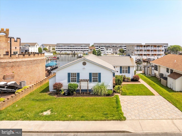 156 Captains Quarters Rd, Ocean City, MD 21842 - view of front of house with a water view, a residential view, and a front yard