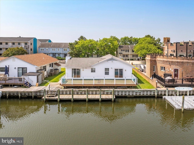 156 Captains Quarters Rd, Ocean City, MD 21842 - back of property with a deck with water view, a shed, and a residential view