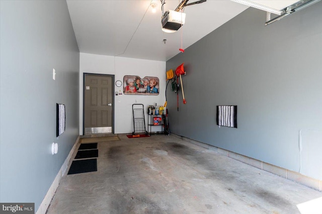 8607 Wintergreen Ct Unit 204, Odenton, MD 21113 - garage featuring a garage door opener