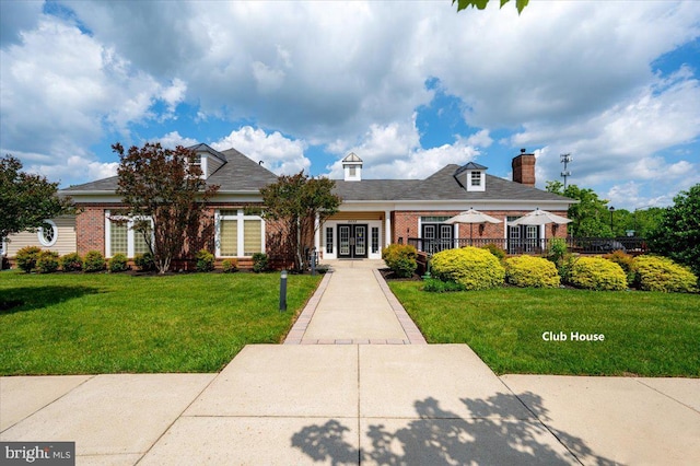 8607 Wintergreen Ct Unit 204, Odenton, MD 21113 - view of front of home featuring brick siding, french doors, and a chimney