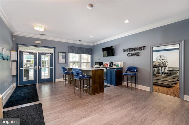 8607 Wintergreen Ct Unit 204, Odenton, MD 21113 - bar with french doors, light wood-style floors, crown molding, baseboards, and recessed lighting