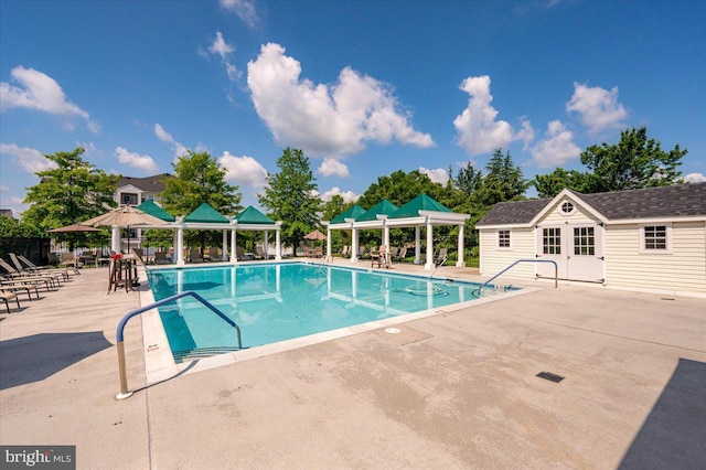 8607 Wintergreen Ct Unit 204, Odenton, MD 21113 - community pool featuring a gazebo, a patio, an outdoor structure, and an exterior structure