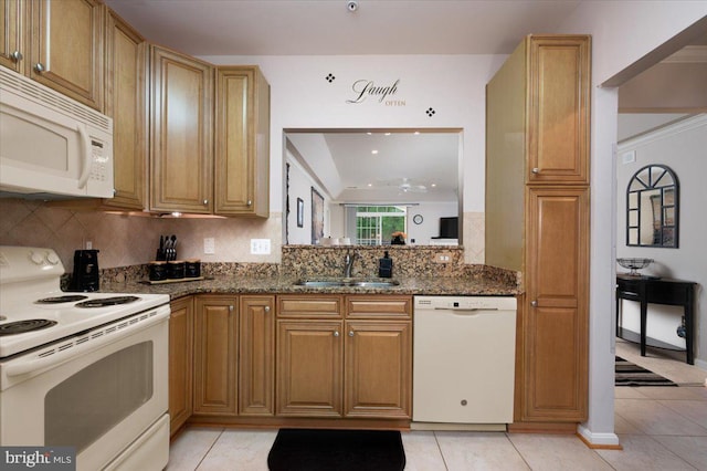 8607 Wintergreen Ct Unit 204, Odenton, MD 21113 - kitchen featuring white appliances, a sink, backsplash, dark stone counters, and light tile patterned flooring