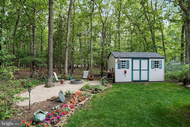 128 Rowan Ct, Manahawkin, NJ 08050 - view of shed featuring a fire pit and a view of trees