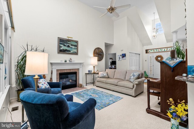 128 Rowan Ct, Manahawkin, NJ 08050 - carpeted living room featuring high vaulted ceiling, a ceiling fan, and a fireplace