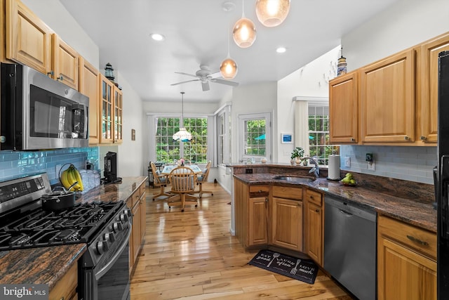 128 Rowan Ct, Manahawkin, NJ 08050 - kitchen featuring stainless steel appliances, a ceiling fan, light wood-type flooring, tasteful backsplash, and recessed lighting