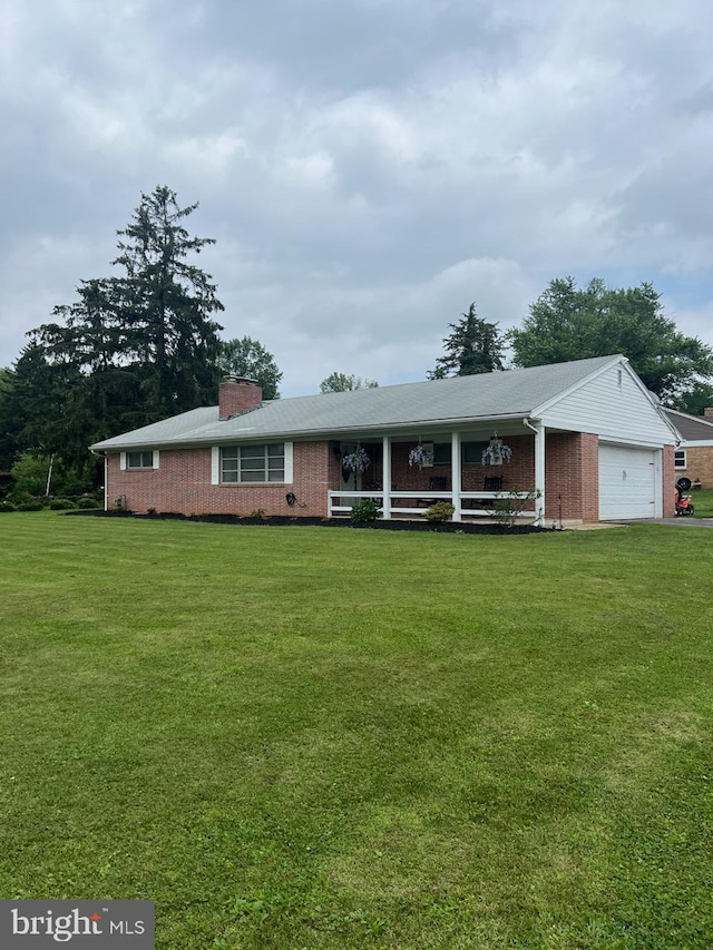 2351 Brougher Ln, York, PA 17408 - single story home featuring brick siding, a front yard, a chimney, and an attached garage
