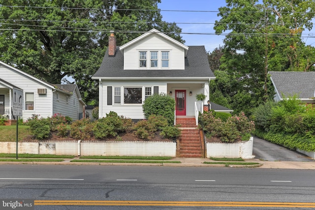 1029 Pennsylvania Ave, Hagerstown, MD 21742 - view of front of house featuring a chimney, a shingled roof, and stairs