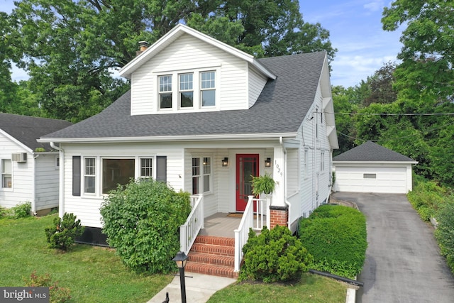 1029 Pennsylvania Ave, Hagerstown, MD 21742 - bungalow-style house with an outdoor structure, a detached garage, a shingled roof, and covered porch