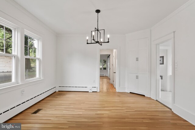 1029 Pennsylvania Ave, Hagerstown, MD 21742 - unfurnished dining area featuring a chandelier, baseboard heating, light wood finished floors, crown molding, and a baseboard heating unit