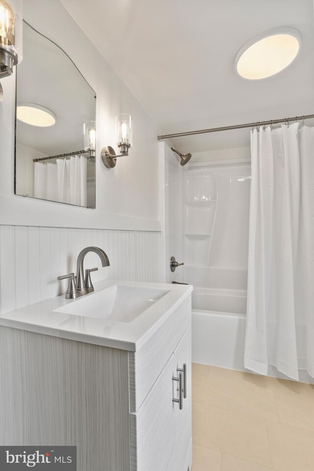 1029 Pennsylvania Ave, Hagerstown, MD 21742 - full bath with vanity, wainscoting, shower / bath combo with shower curtain, and tile patterned flooring