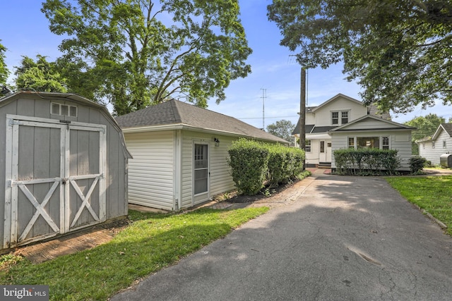 1029 Pennsylvania Ave, Hagerstown, MD 21742 - view of front facade featuring a storage shed and a shingled roof