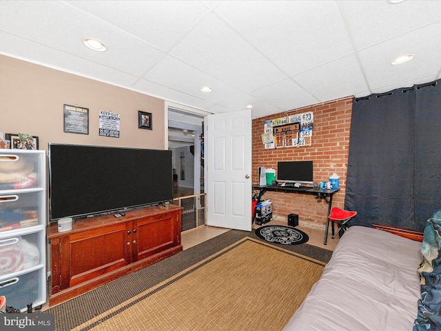 15809 Mount Everest Ln, Silver Spring, MD 20906 - living area with recessed lighting, brick wall, and a drop ceiling