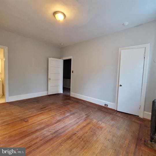 1212 Park Rd NW, Washington, DC 20010 - unfurnished room featuring baseboards and wood finished floors