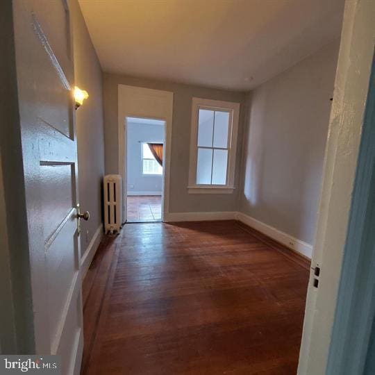1212 Park Rd NW, Washington, DC 20010 - unfurnished room with radiator and wood finished floors
