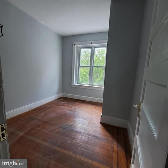 1212 Park Rd NW, Washington, DC 20010 - unfurnished room with baseboards and wood finished floors