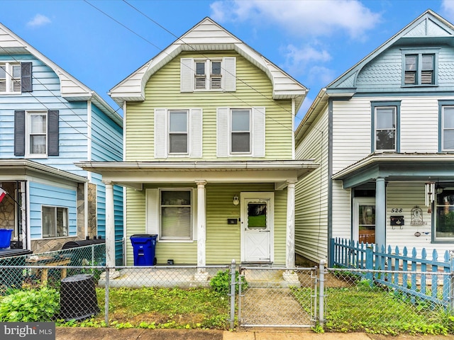 526 W Potomac St, Brunswick, MD 21716 - view of front of property with covered porch, a gate, and a fenced front yard