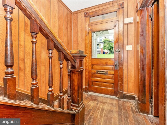 526 W Potomac St, Brunswick, MD 21716 - entryway with wood-type flooring, wooden walls, and stairs