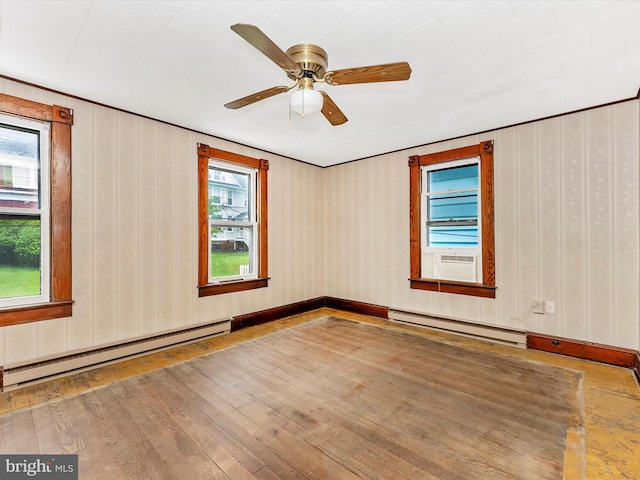 526 W Potomac St, Brunswick, MD 21716 - unfurnished room with a baseboard radiator, hardwood / wood-style flooring, cooling unit, and a ceiling fan
