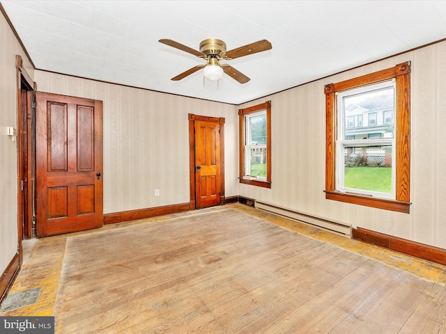 526 W Potomac St, Brunswick, MD 21716 - unfurnished room featuring a baseboard radiator, wood-type flooring, and ceiling fan