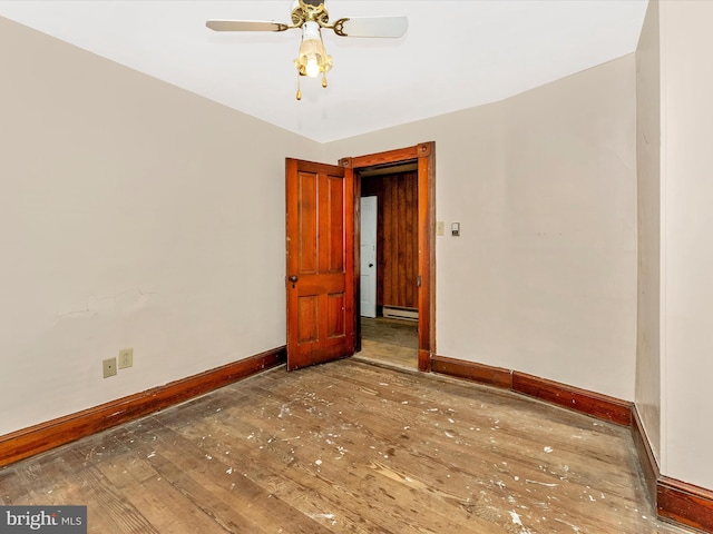 526 W Potomac St, Brunswick, MD 21716 - empty room featuring wood-type flooring, baseboard heating, and ceiling fan
