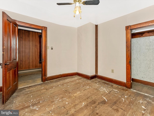 526 W Potomac St, Brunswick, MD 21716 - unfurnished bedroom featuring a baseboard radiator, hardwood / wood-style floors, and a ceiling fan