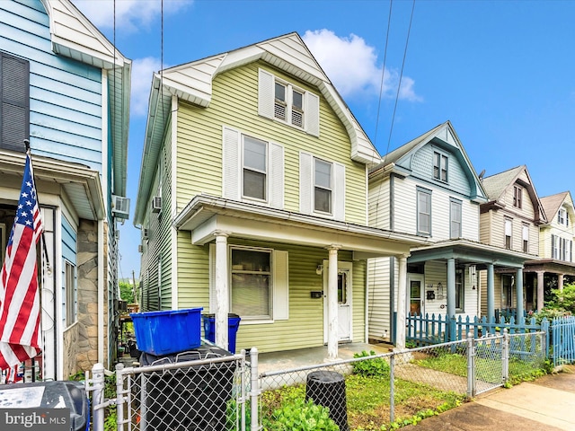 526 W Potomac St, Brunswick, MD 21716 - view of front of home featuring a porch, a gate, and a fenced front yard