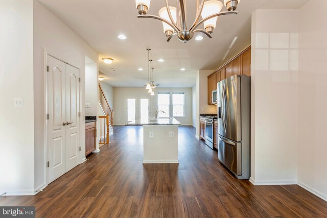 519 Long Wall Dr, Reisterstown, MD 21136 - kitchen featuring appliances with stainless steel finishes, dark wood finished floors, recessed lighting, brown cabinets, and a chandelier