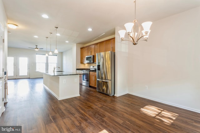 519 Long Wall Dr, Reisterstown, MD 21136 - kitchen featuring stainless steel appliances, brown cabinetry, dark wood finished floors, a ceiling fan, and recessed lighting
