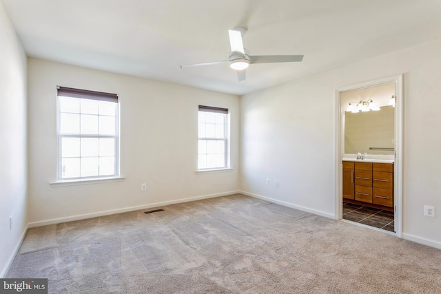 519 Long Wall Dr, Reisterstown, MD 21136 - unfurnished bedroom featuring carpet floors, ensuite bath, and ceiling fan