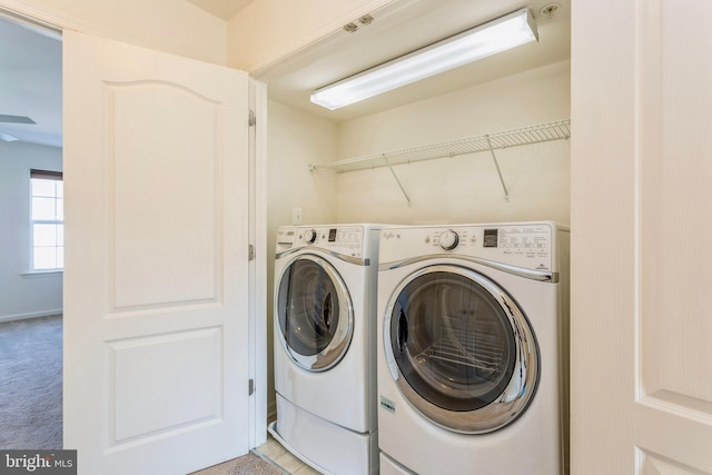 519 Long Wall Dr, Reisterstown, MD 21136 - laundry area with washing machine and clothes dryer and light colored carpet