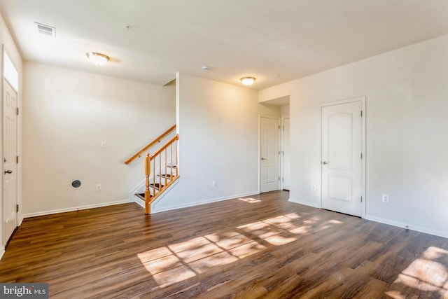 519 Long Wall Dr, Reisterstown, MD 21136 - empty room featuring wood finished floors, stairs, and fire sprinkler in ceiling