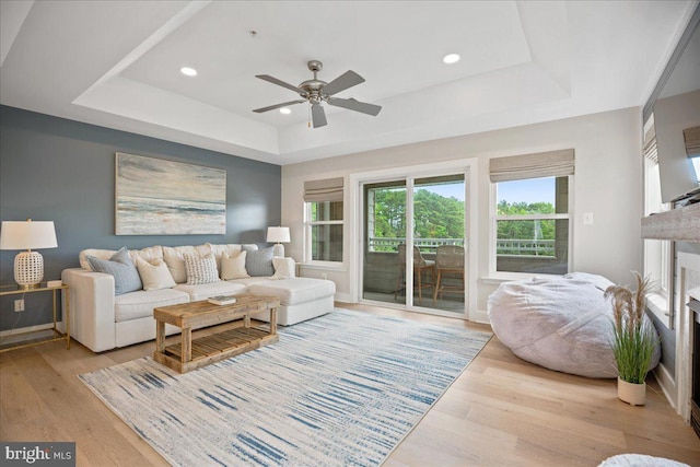 931 Oyster Bay Pl, Solomons, MD 20688 - living area featuring a tray ceiling, ceiling fan, light wood-style floors, and recessed lighting