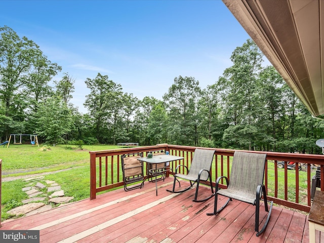 357 Crestview Mountain Rd, Augusta, WV 26704 - deck with a yard, a playground, and view of wooded area