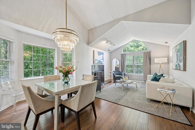 3508 Waltham Ct, Yardley, PA 19067 - dining area with vaulted ceiling, wood-type flooring, a chandelier, and a fireplace