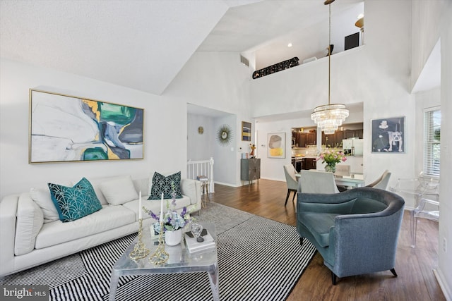 3508 Waltham Ct, Yardley, PA 19067 - living area featuring a chandelier, dark wood-style floors, and high vaulted ceiling