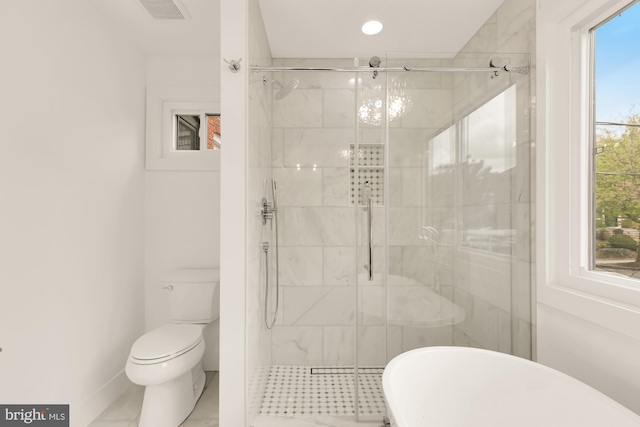 4327 2nd St NW, Washington, DC 20011 - full bathroom featuring toilet, a stall shower, a soaking tub, and baseboards
