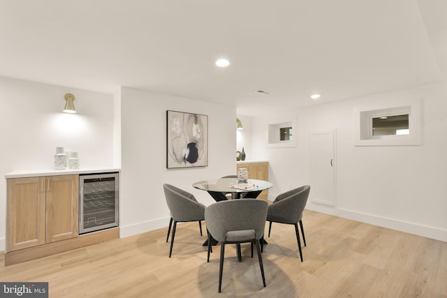 4327 2nd St NW, Washington, DC 20011 - dining space with beverage cooler, a dry bar, light wood finished floors, baseboards, and recessed lighting