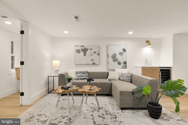 4327 2nd St NW, Washington, DC 20011 - living room featuring a bar, beverage cooler, wood finished floors, recessed lighting, and baseboards