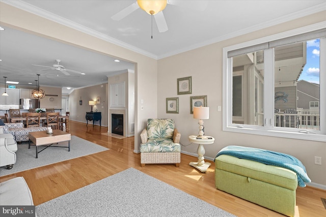 38336 Ocean Vista Dr Unit 1098, Selbyville, DE 19975 - living area featuring a ceiling fan, crown molding, wood finished floors, a fireplace with flush hearth, and recessed lighting