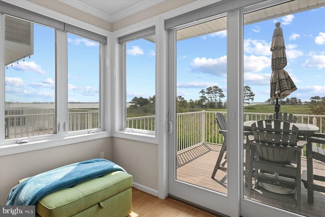 38336 Ocean Vista Dr Unit 1098, Selbyville, DE 19975 - sunroom / solarium featuring crown molding, wood finished floors, and a deck